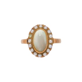 An opal, seed pearl and 14k gold ring