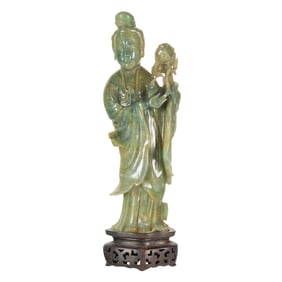 A Chinese green jadeite figure of a celestial maiden