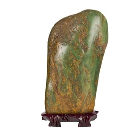 A Chinese russet and spinach jade boulder scholar's stone