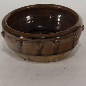A Chinese russet glazed drum-form bowl