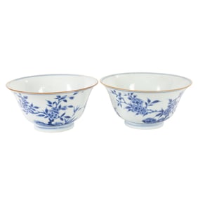 A pair of Chinese blue and white 'Bamboo and Prunus' bowls