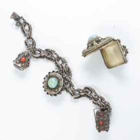 A silver and gemstone charm bracelet