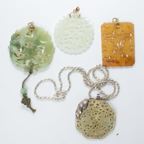 A group of jade pendants