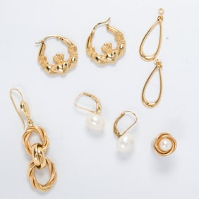 A group of 14k gold earrings