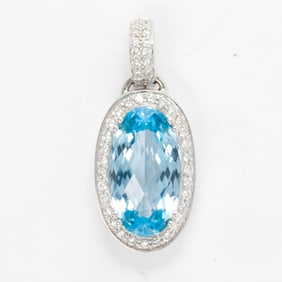 A Topaz, diamond and 14k gold pendant