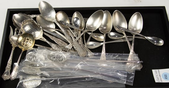 A lot of mostly sterling spoons: a Gorham Camellia sugar spoon; (8) Dutch fig shaped spoons; (6) ice