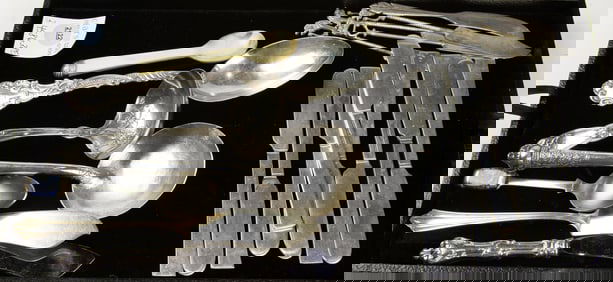 A sterling flatware lot: Alvin lily ladle; 8 International Continental butter spreaders