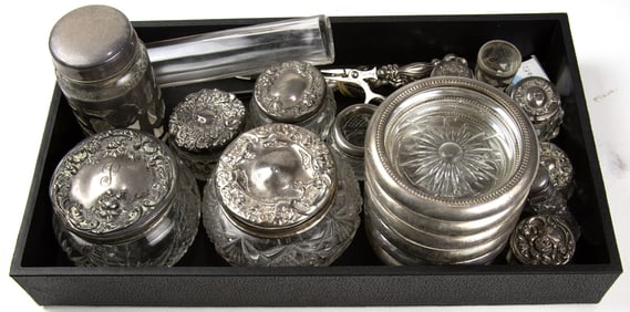 A large lot of dresser boxes with silver lids, bottles and dresser implements
