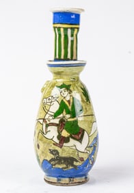 A Persian pottery hookah base decorated with horse and rider