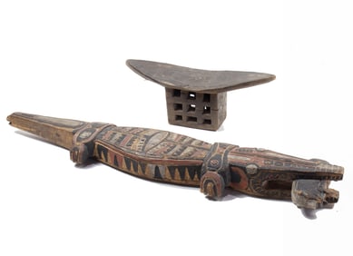 A Papua New Guinea polychrome carved wood crocodile, 29.5"l and an African head rest, 6"h x 14.5"l