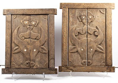 A pair of African carved window fronts