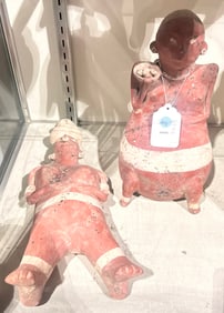 Two Precolumbian style Olmec red clay seated or standing 'baby' figures