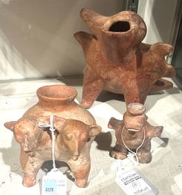 Three Precolumbian Olmec style red clay animal figural vessels