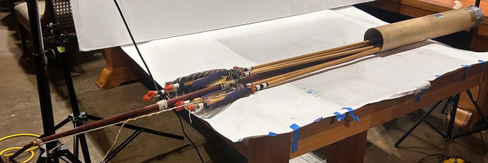 A lot of long bow and feather arrows