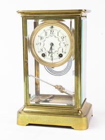 A Seth Thomas brass four-glass mantel clock