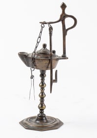 A vintage oil lamp on stand