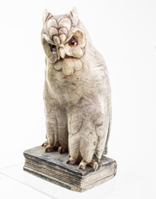A marble owl form bookend with glass inset eyes