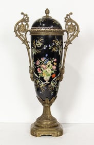 A French style bronze mounted porcelain two handled covered urn