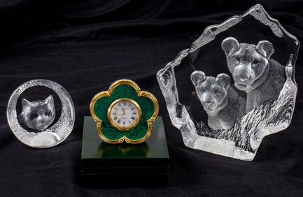Two Mat Johnasson glass reliefs of animals and a Kitsey & Co. London quatrefoil enamel dresser clock