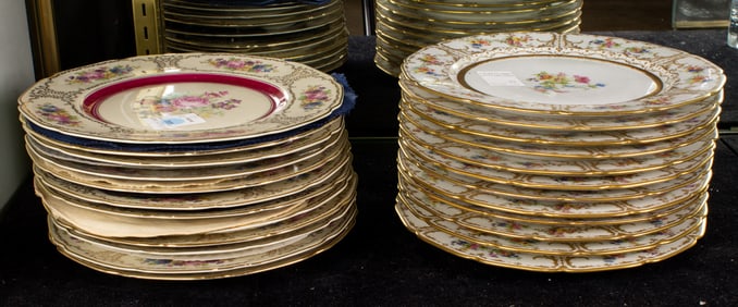 Two sets of European floral decorated porcelain dinner plates