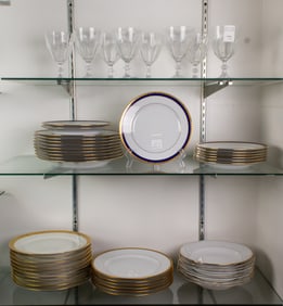 A group of cut glass and porcelain dinnerware including Tiffany for Limoges