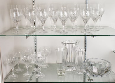 An assembled group of glass stemware and vases
