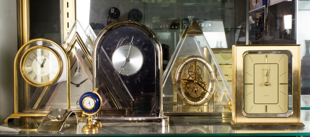 A group of seven desk clocks