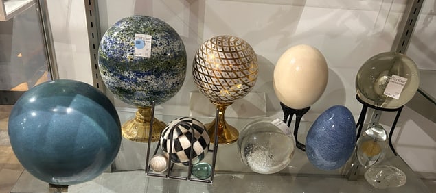 A collection of glass and other medium orbs and eggs
