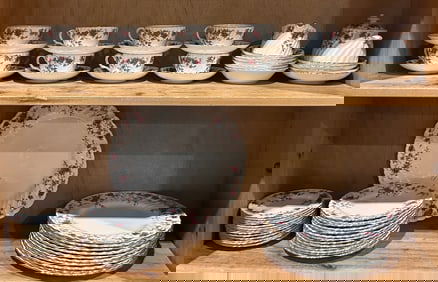 A Minton bone china dinner service in the 'Ancestral' pattern