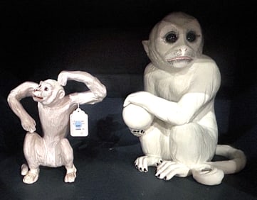 Two Italian white glazed pottery monkeys