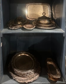 A large group of silver plated catering accessories