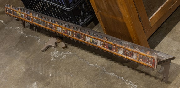 A Folk Art polychrome decorated shelf with later bracket supports
