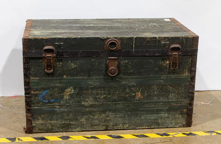 A primitive large plank wood pioneer trunk