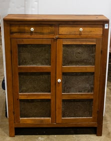 A Primitive pie chest with decorative metal door panels