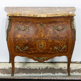 A French Louis XV marquetry decorated commode