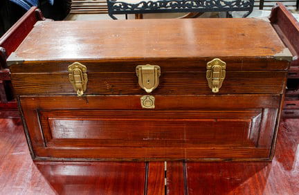An antique sewing box with period spools in egg firm containers