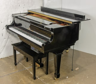A Young Chang baby grand player piano