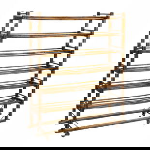 A French bakers bread cooling rack: A French bakers bread cooling rack, circa 1900, with six fixed and turned shelves, the base with metal supports, and retains original casters, 55"h x 42.5"w