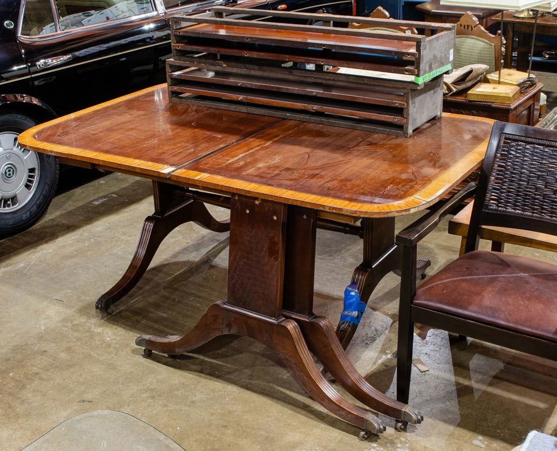 A Regency style extending mahogany dining table: A Regency style extending mahogany dining table, with four leaves in original case, 30"h x 70"w x 46"d