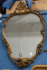 A Rococo style giltwood cartouche form mirror