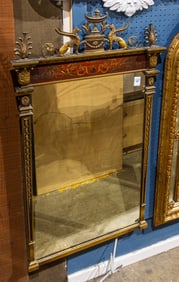 An Empire style polychrome and parcel gilt mirror