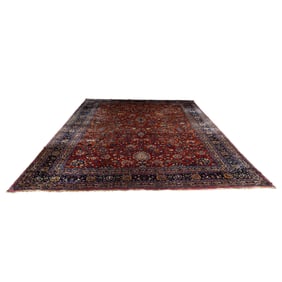 An antique Persian Meshed carpet