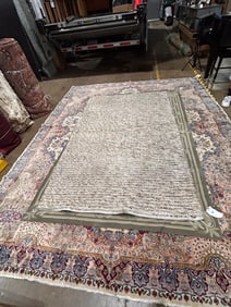 A contemporary wool braided carpet