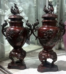 A pair of Japanese bronze covered urns