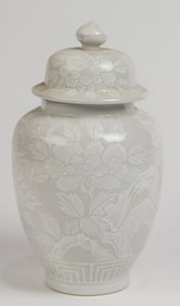 A Japanese grey and white glazed covered jar