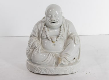 A Chinese Dehua figure of Budai