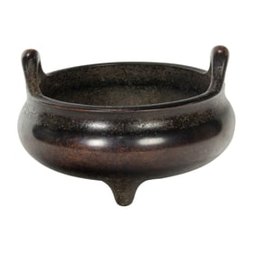 A Chinese bronze tripod censer