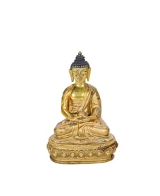 A Sino-Tibetan gilt bronze figure of the Medicine Buddha