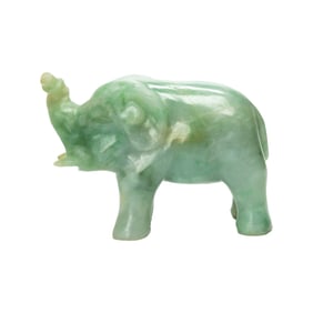 A Chinese green jadeite elephant figure with stand