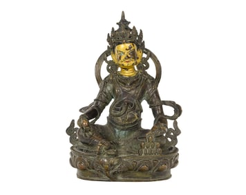 A Tibetan bronze figure of Jambhala